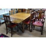 An oak draw leaf dining table on barley twist legs and cross stretchers, W107cm, together with a set