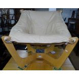 A cream leather and laminated easy chair, purchased from John Lewis