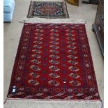 A red ground Tekke Turkoman rug, 147cm x 105cm, and a Persian Bagface 72cm x 61cm (2)