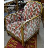 An Art Deco upholstered and walnut-framed armchair