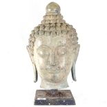 A metal Buddha's head on stand, height 45cm