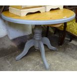 A painted polished circular pine kitchen table, W100cm