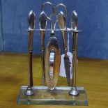 A silver manicure set on stand (plated scissors)