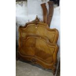 A French carved and panelled walnut 4'6" bed with rails