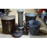 A paraffin heater, a bucket, a miner's lamp, a bentwood bin etc