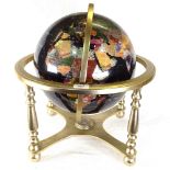 A stone set terrestrial globe in gimballed brass stand, 44cm diameter overall
