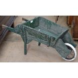 A rustic child's painted wheelbarrow