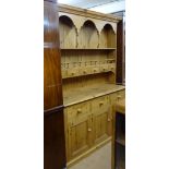 A large modern polished pine 2-section kitchen dresser, W142cm, H200cm