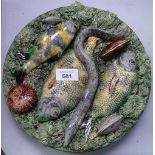 A Portuguese Majolica wall plaque depicting fish, eel etc, 25.5cm