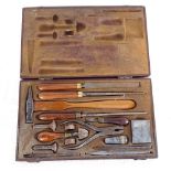 Specialist mahogany-cased set of tools, including hammer, files, punches, agate burnisher etc,