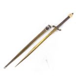 A brass stiletto dagger with carved bone hilt terminal, overall length 41cm