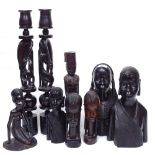 A pair of carved ebony candlesticks, 49.5cm, 2 pairs of ebony figures, and 3 others
