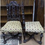 A pair of 19th century carved oak Carolean style side chairs, with upholstered seats, and X-framed