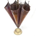 An umbrella design embossed copper stick stand