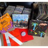 A case of 45rpm records and a box of LPs