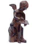A Vintage patinated spelter Cupid figure, height 20.5cm
