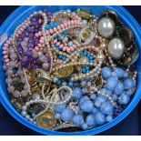 A tub of modern costume jewellery