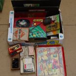 A box of board games, chessmen etc