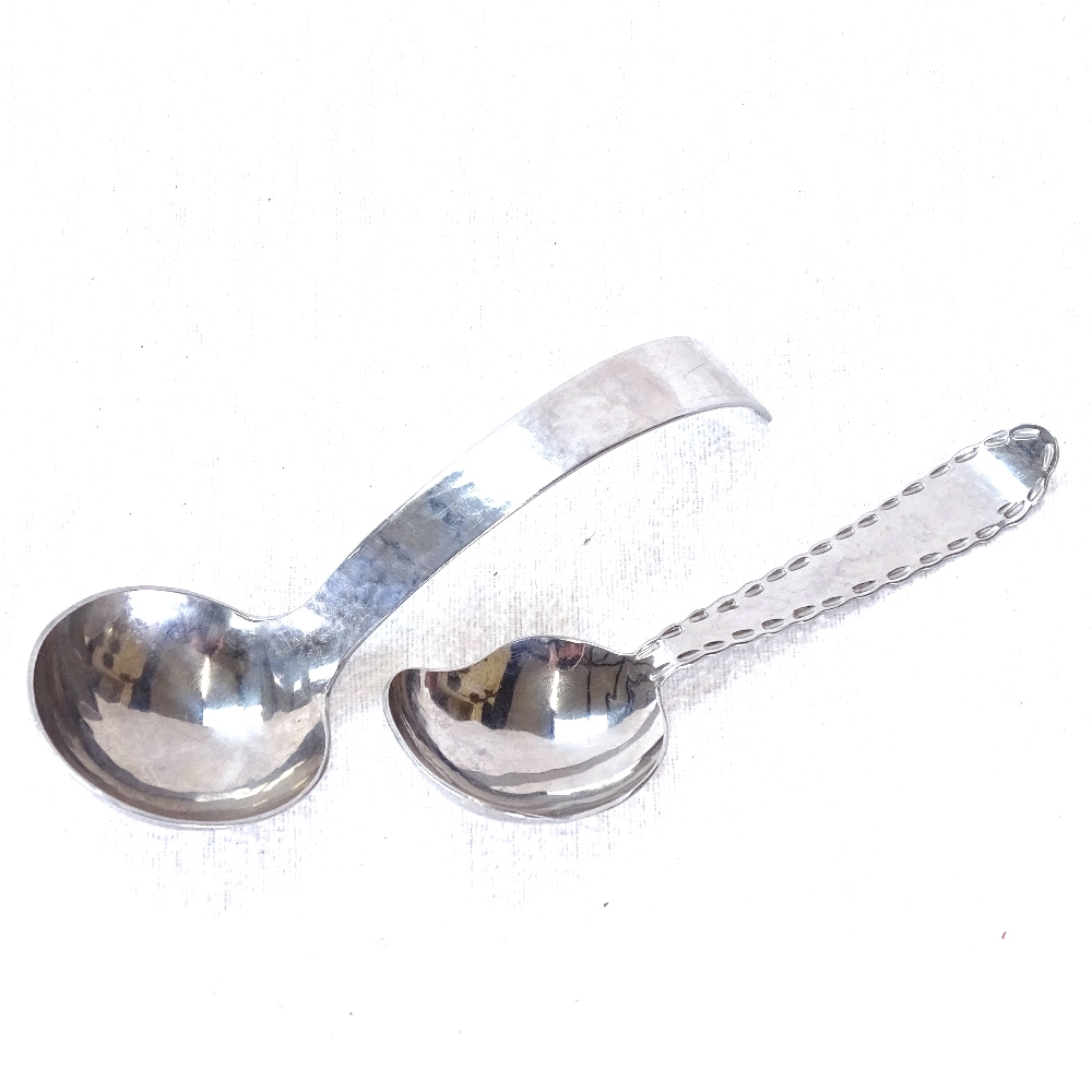 2 white metal Keswick caddy spoons, largest 13cm