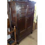 Good quality 1920s joined oak hall cupboard, with 2 Arcadian carved and panelled doors, on stile