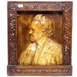 A carved wood and moulded portrait plaque, titled Te Hi Lily H Montaguor, height 61cm