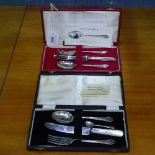 2 silver-cased christening sets, and a silver mustard spoon