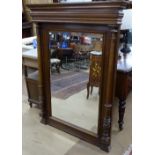 A large French walnut over mantel mirror, with reeded columns, W104cm, H140cm