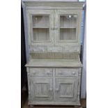 A distressed painted 2-section dresser with fitted drawers and cupboards, W97cm, H184cm