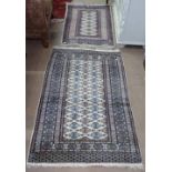 2 Pakistani cream ground silk and wool rugs, from Samad's London 120cm x 78cm, and 95cm x 65cm