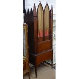 An early 19th century Gothic cylinder or barrel chamber organ, the base containing further