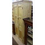 A Continental polished pine larder cupboard, with 2 panelled doors, W83cm, H178cm