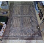 A salmon ground Afghan design rug, 198cm x 120cm
