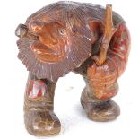 A Tyrolean carved and painted wood man smoking a pipe, height 14cm