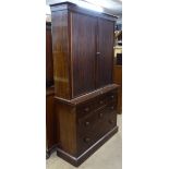 An Antique mahogany 2-section bookcase, the top having tambour fitted doors with adjustable shelves,