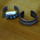 A heavy Egyptian silver bangle, and a Tibetan silver and turquoise set bangle (2)