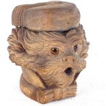 A carved wood smoker's pot in the form of a dog, height 11.5cm