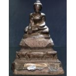 An Oriental silver-clad Buddha on stepped base, height 22cm