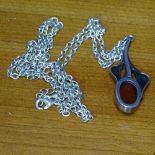 A silver and amber set pendant and chain