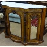 A Victorian serpentine-front walnut credenza, with shaped marble top, 3 mirrored cupboard doors, and
