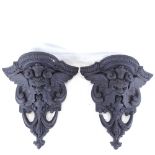 A pair of painted composition wall brackets, height 31cm