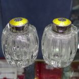A pair of Danish sterling silver and yellow enamel glass pepperettes, by Hugo Grun of Copenhagen,