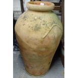 A large terracotta olive oil jar, height 86cm