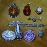 2 amber pendants, a Millefiori and silver-mounted pendant, and other silver brooches