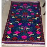 A blue ground Baluchi rug with pictorial decoration, 143cm x 90cm