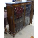 1930s mahogany bow-front display cabinet, with 2 glazed doors, on claw and ball feet, W120cm, H125cm
