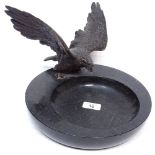 A marble dish, 26cm across, surmounted by a bronze eagle