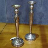 A pair of fluted engraved silver candlesticks, marked sterling to the base, height 26.5cm