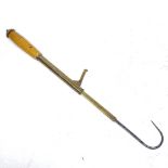 A brass angler's fish hook, 84cm extended