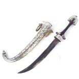 An Eastern dagger with brass and white metal decorated scabbard, length 39cm