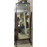 An Edwardian mahogany-framed chevel mirror